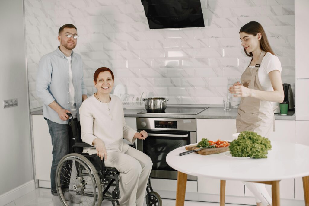 pexels photo 7446752 7446752 Three adults enjoying family time preparing food in a bright kitchen.